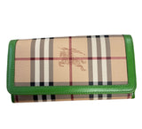 Burberry classic wallet with green trim.